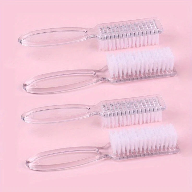 A set of four clear plastic nail art brushes with long handles and white bristles displayed on a pink background.