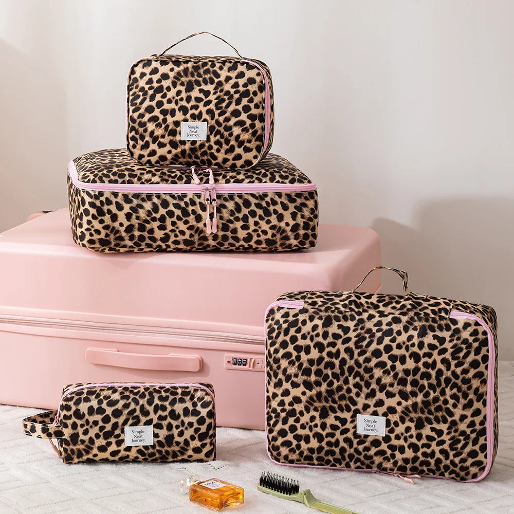 A leopard print toiletry bag in brown and black spots resting on a pink storage box.