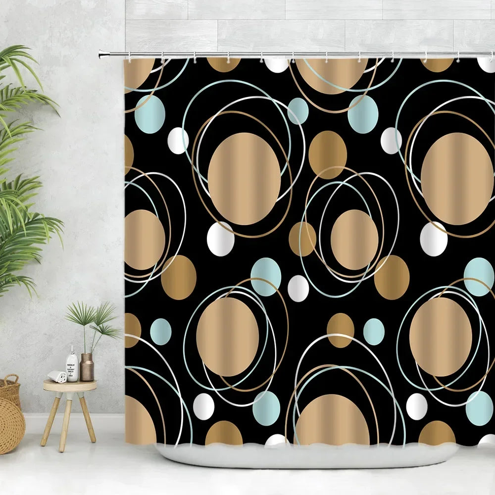 Geometric black and white fabric shower curtain featuring gold and light blue circular patterns.