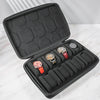 A black portable leather watch travel case with a soft lining, open to display several watches.