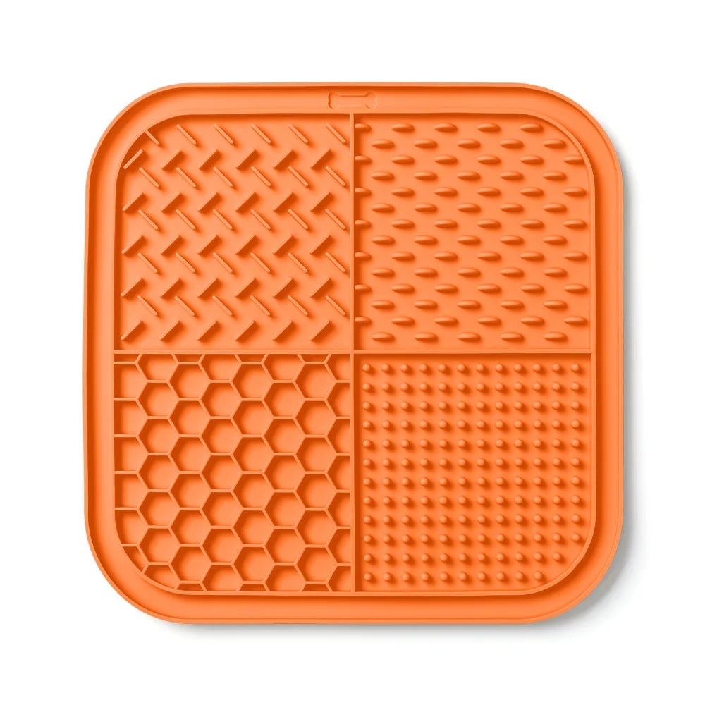 Orange silicone lick mat for dogs and cats with suction cups
