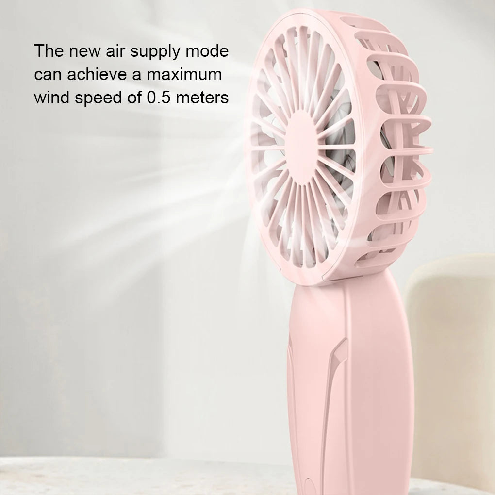 A pink handheld fan is shown blowing a stream of air, demonstrating its new air supply mode.
