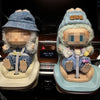 A pair of Labubu-inspired car seat accessories featuring soft, fuzzy fabric and storage clips for infants.
