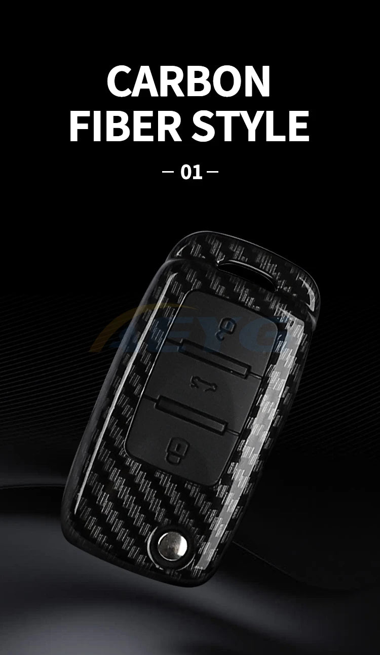 A close-up view of a black carbon fiber style car key cover for VW and Skoda models.