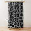 A black and white leopard print shower curtain hanging from a gold rod.