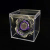 A Valkyrie Volt S4-70V metal spinning top with launcher displayed inside a clear plastic box.