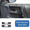 Carbon fiber trim kit for Toyota 4Runner featuring a black headlight assembly.