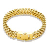 A thick gold stainless steel link chain bracelet shown against a white background.