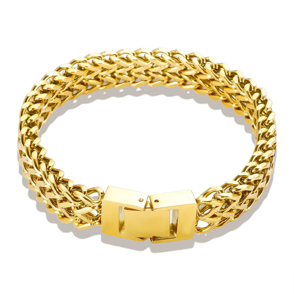 A thick gold stainless steel link chain bracelet shown against a white background.