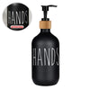 Black refillable soap dispenser bottle with white text printing on the body.