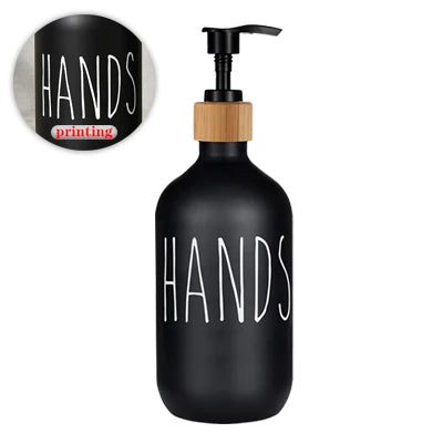 Black refillable soap dispenser bottle with white text printing on the body.