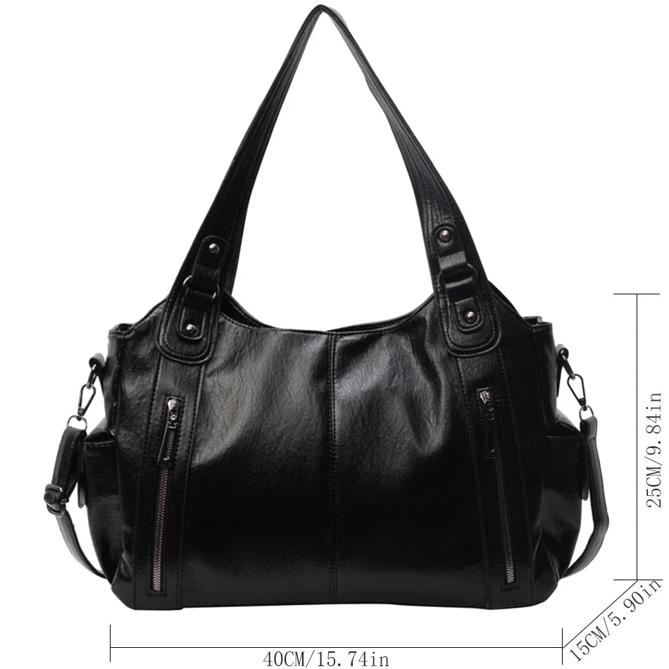 Black vintage leather tote bag with multiple pockets shown from the front.
