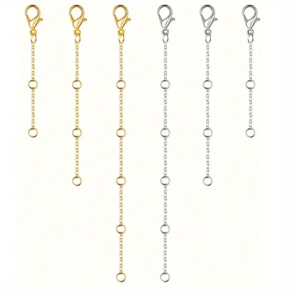 A set of gold-plated necklace extenders featuring lobster clasps and delicate chains.