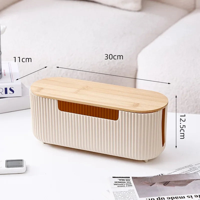 A light wood and cream cable management box organizer for desk and home use.