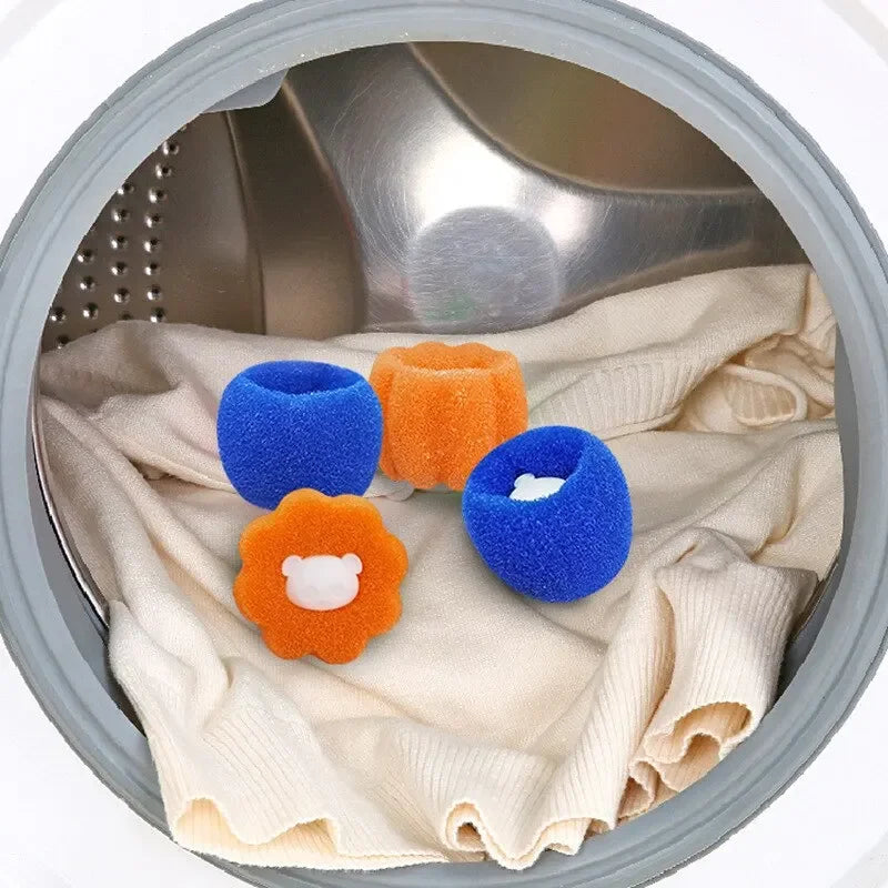 Reusable laundry balls in blue and orange are shown inside a washing machine drum.