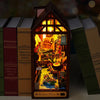 A miniature book nook kit featuring a detailed scene of a town built within an attic-like structure.