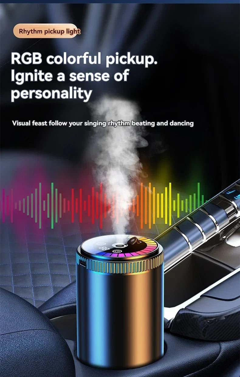 A rechargeable car aroma diffuser with a colorful light is placed on a dark car interior surface.