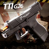 A close-up view of the TTI G26 pistol with a wooden shell visible, resting on a dark surface.