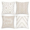 A set of four decorative pillowcases featuring a geometric white and beige pattern.