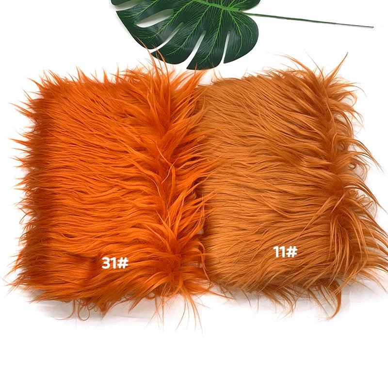 Two bundles of bright orange faux fur fabric for DIY sewing, doll hair, and cosplay