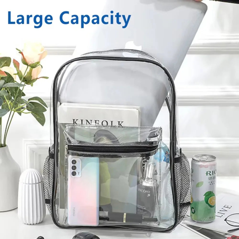 A clear transparent PVC backpack with black cushioned straps is shown next to a laptop and a potted plant.