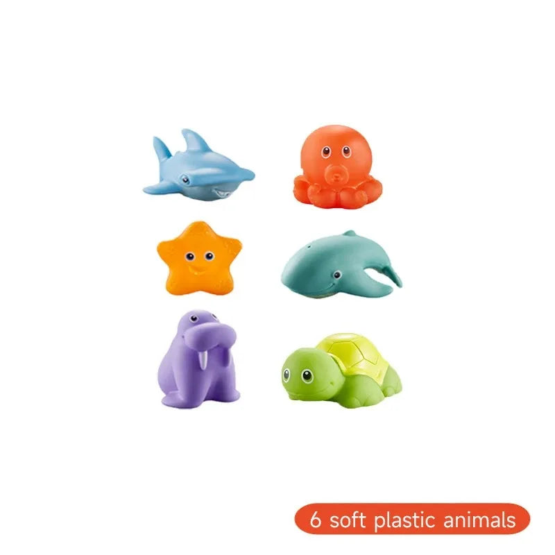 A set of six soft plastic animals including a blue shark, an orange fish, a yellow bird, a blue turtle, and a green sea creat