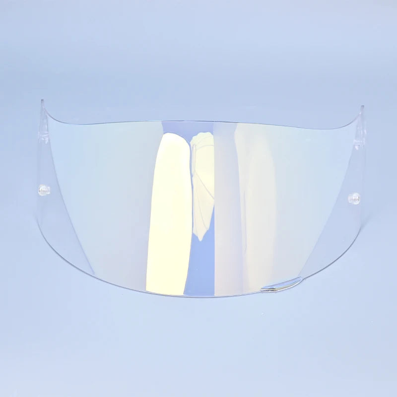 Clear motorcycle helmet visor lens shield displayed against a light blue background.