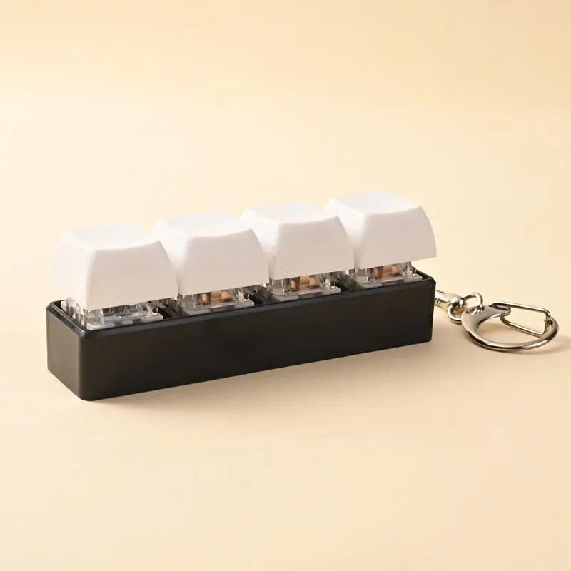 A black keychain holder containing several white LED mechanical fidget toys.