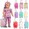 A set of colorful doll travel suitcases in pink, green, and red for 18-inch dolls.