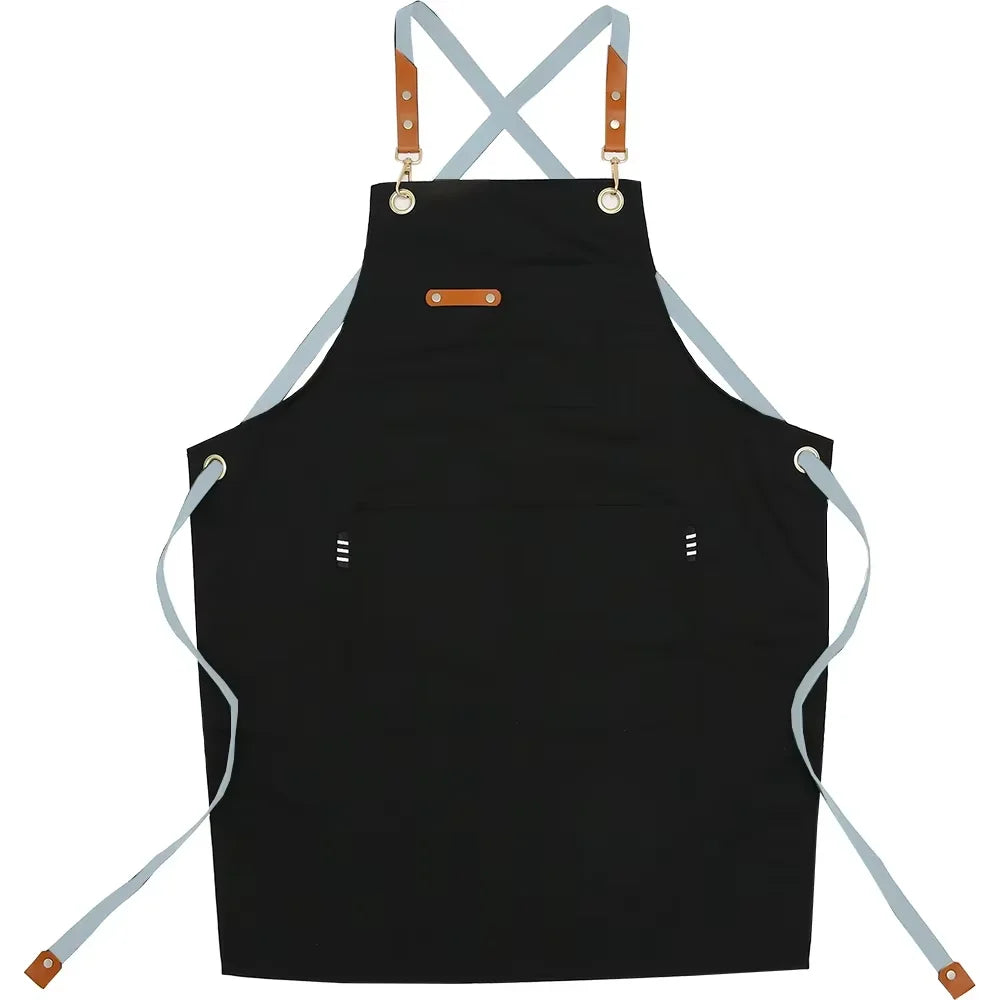 Black adjustable cotton canvas apron with straps and multiple pockets for kitchen or salon use