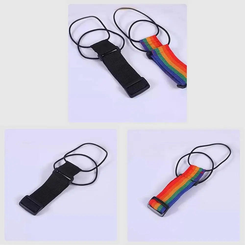 Adjustable luggage strap featuring a black buckle and a colorful striped fabric strap.