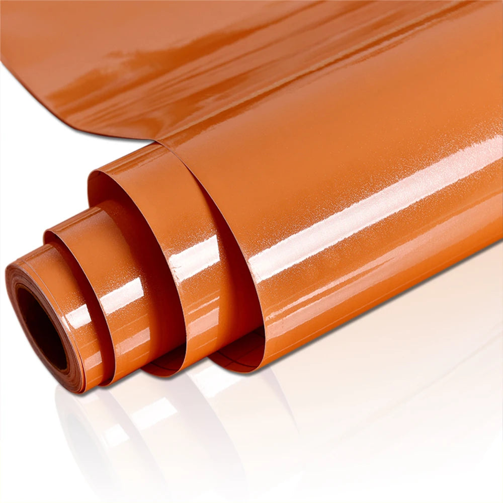 Roll of waterproof self-adhesive marble wallpaper in a warm orange color rolled up