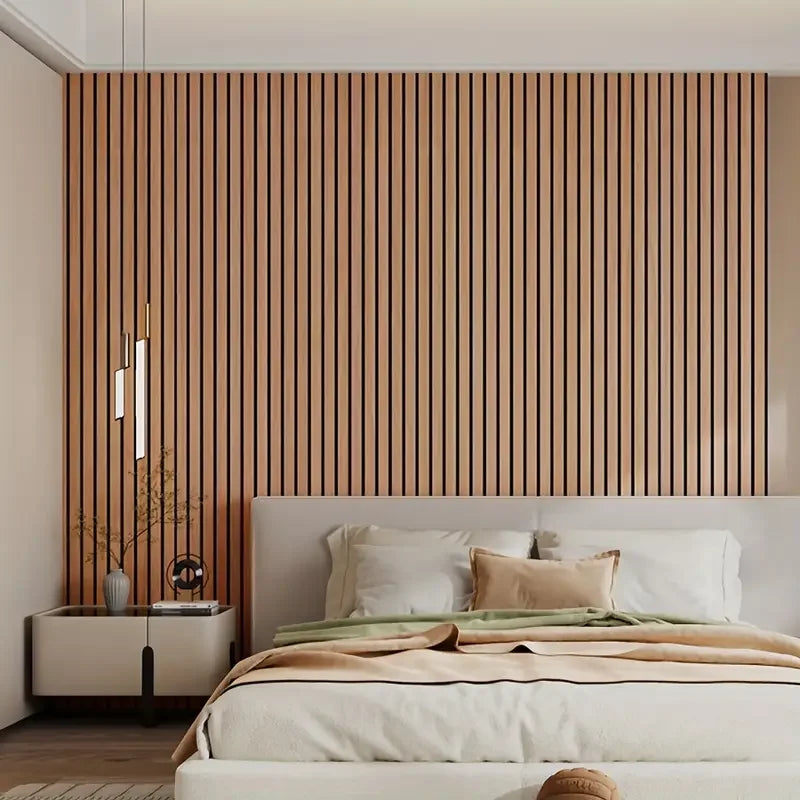 A bedroom featuring a wooden slat wall panel behind a bed with white linens and neutral tones.