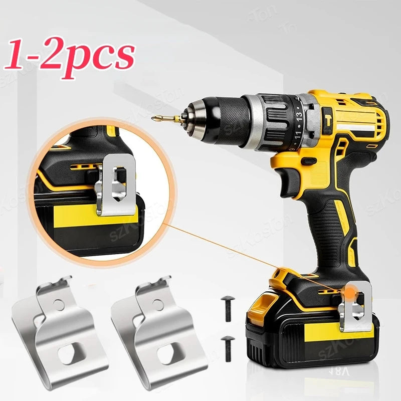 A yellow and black cordless drill with stainless steel belt clip hooks shown alongside spare clips.