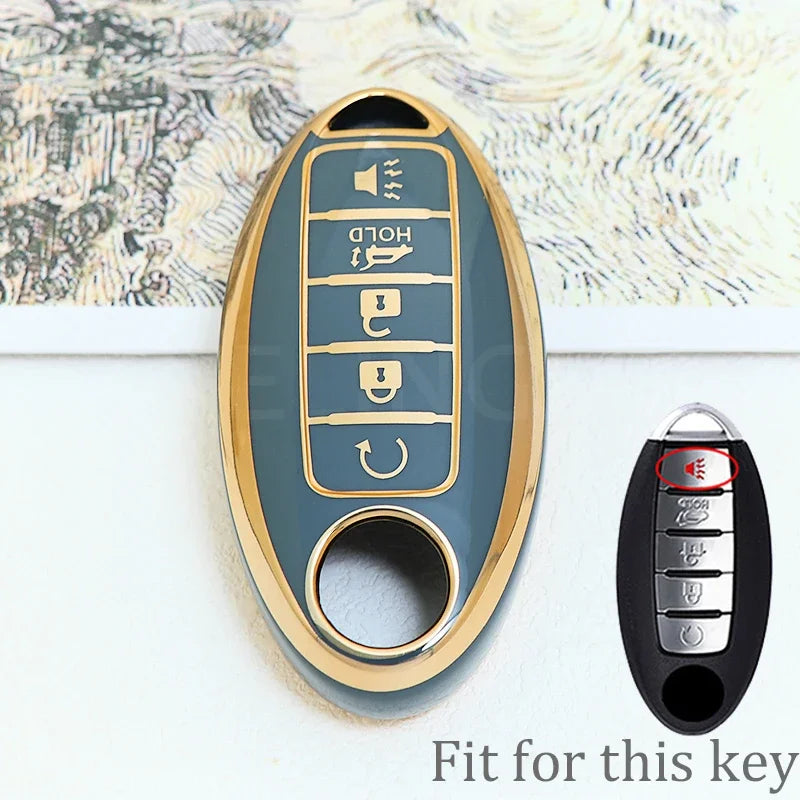 A close-up view of a gold-colored soft TPU car key fob cover with five buttons, shown next to the original black key.