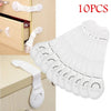 Ten white multi-purpose baby safety straps for securing cabinets and drawers