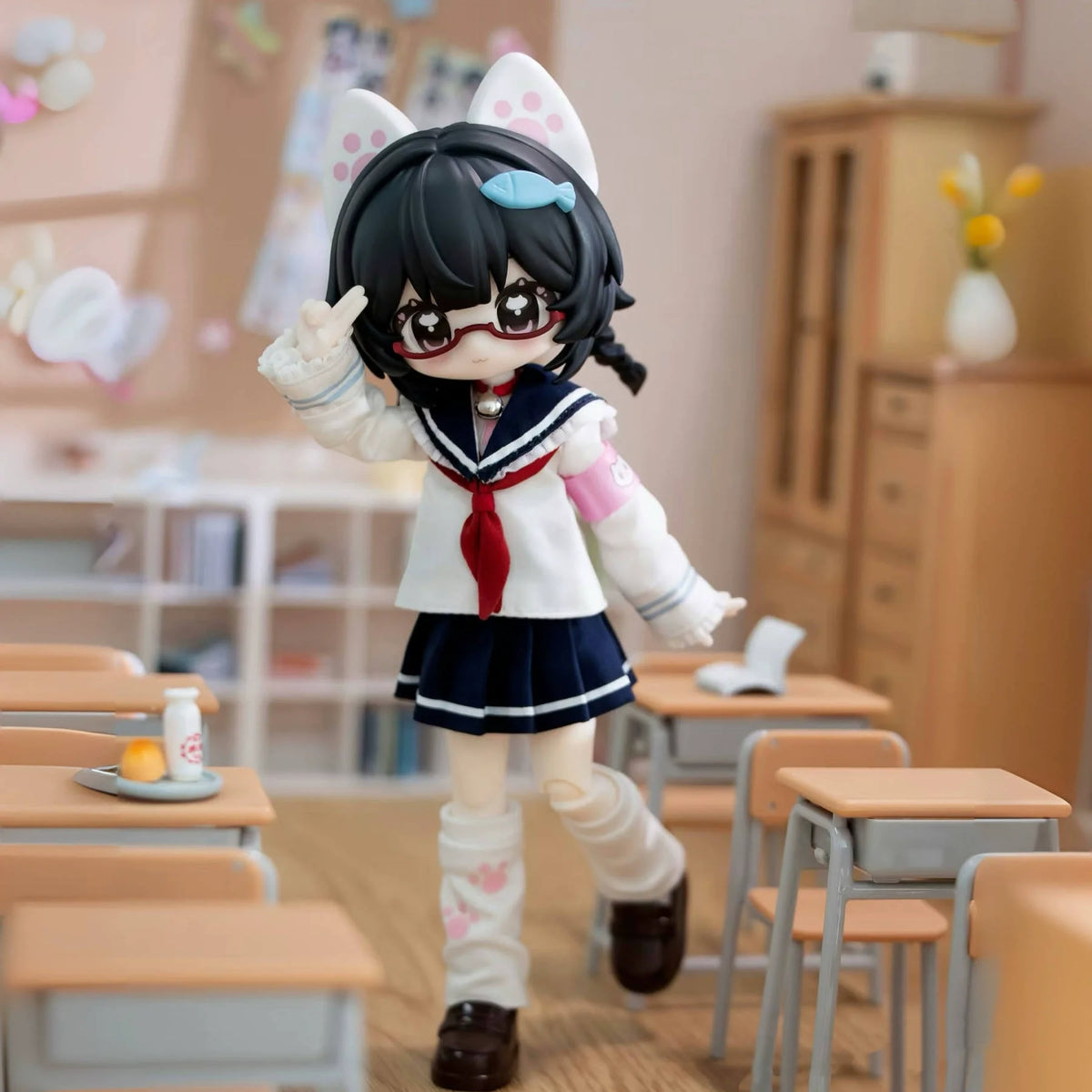 An articulated BJD collectible figurine with black hair and a white school uniform is shown standing on a wooden floor.