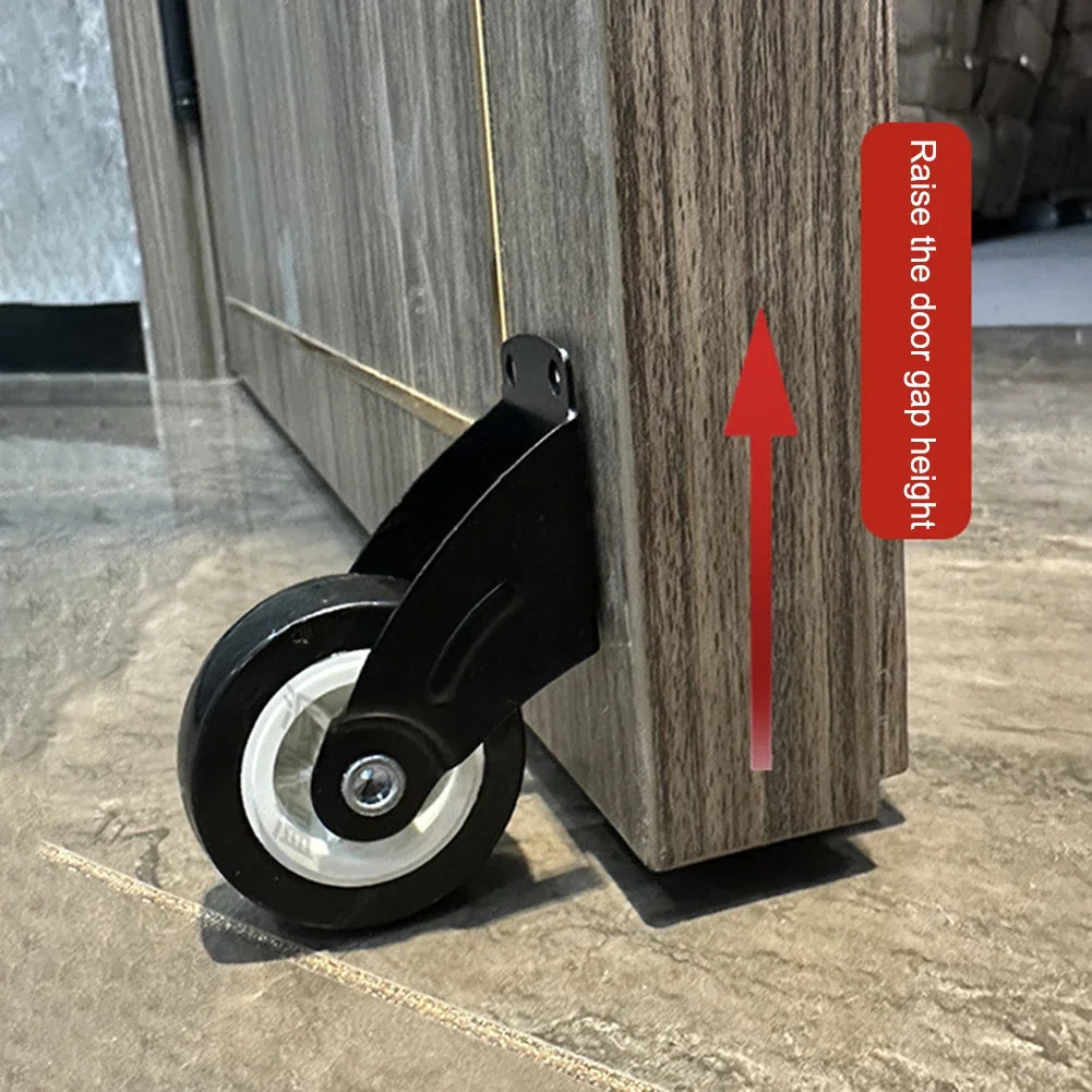 A black door bottom support wheel is shown being installed on a wooden door frame, with an arrow indicating how to raise the 
