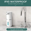 A white touchless automatic soap dispenser is shown next to a kitchen sink faucet, demonstrating its IPX5 waterproof feature.