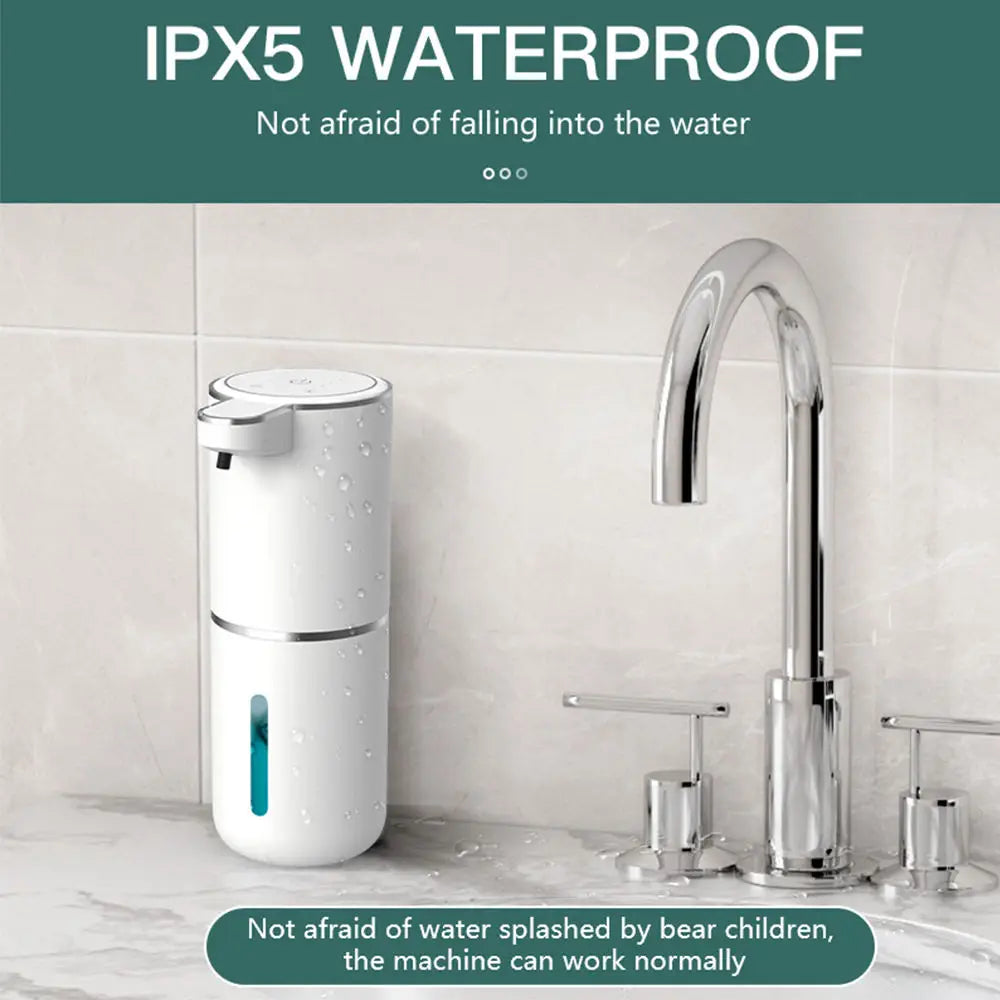 A white touchless automatic soap dispenser is shown next to a kitchen sink faucet, demonstrating its IPX5 waterproof feature.