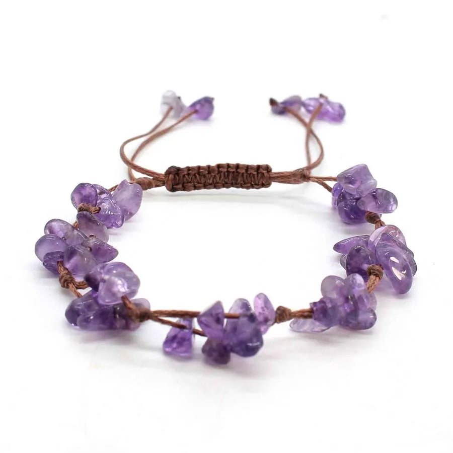 A braided bracelet made of purple amethyst quartz crystal chips and beads.