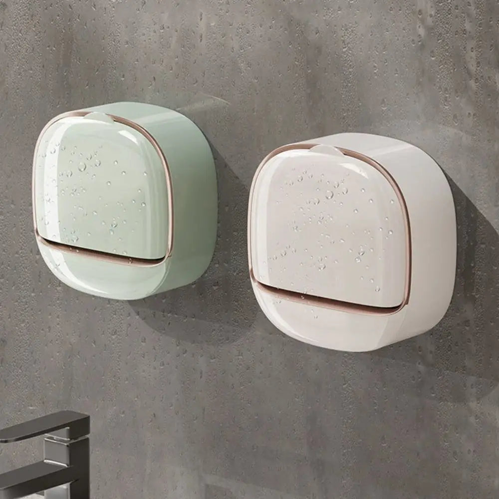 Wall mounted waterproof soap dish with drainage in pale green and white on a gray wall.