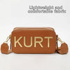 Braune Lederbeuteltasche mit dem Namen KURT auf der Vorderseite, vor weißem Hintergrund.