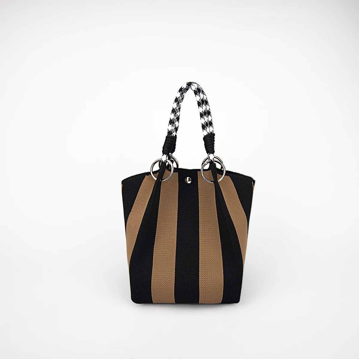 A black and tan striped knitted tote bag with black leather handles against a white background.