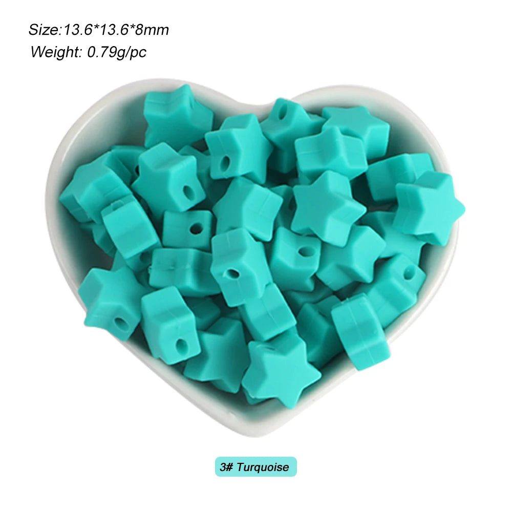 A pile of light blue turquoise silicone crown star heart beads for DIY jewelry making