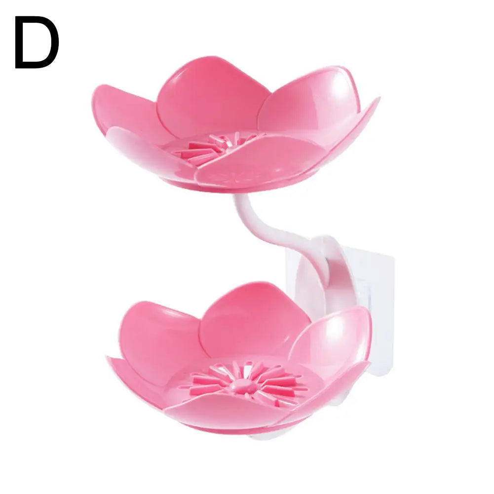 Pink two-tier bathroom storage rack with drainage features