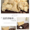 A set of minimalist striped 100% cotton bedding featuring yellow and beige tones.