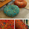 A vibrant orange and teal bohemian cotton linen floor cushion with intricate patterns