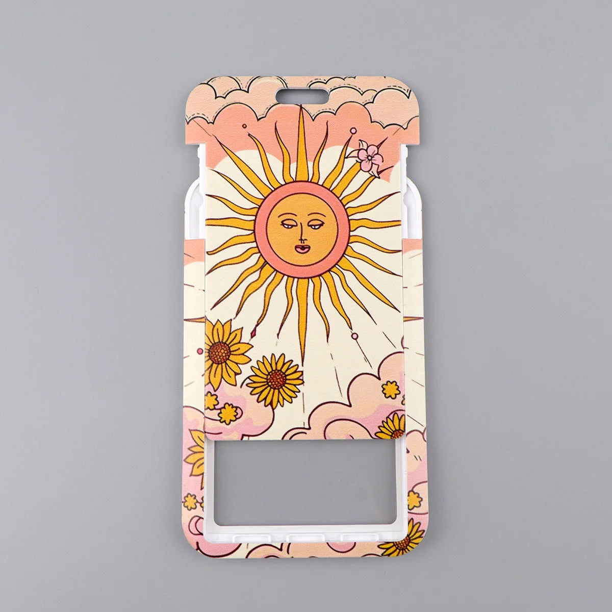 A lanyard featuring a colorful design of a sun and flowers, used as an ID badge holder.