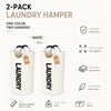 A set of two white extra large foldable laundry hampers with padded handles.